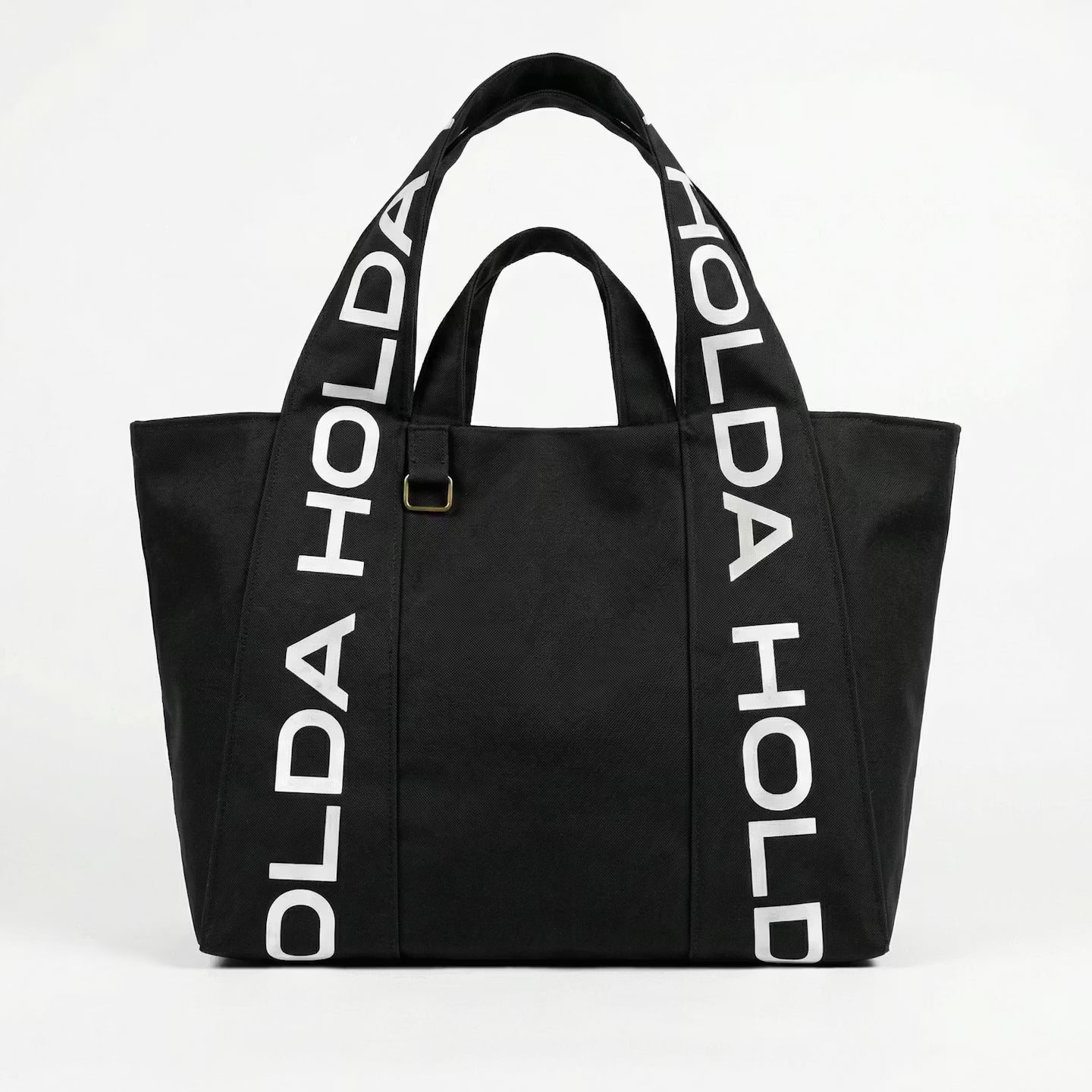 Black tote bag with 'HOLDA' branding on a white background